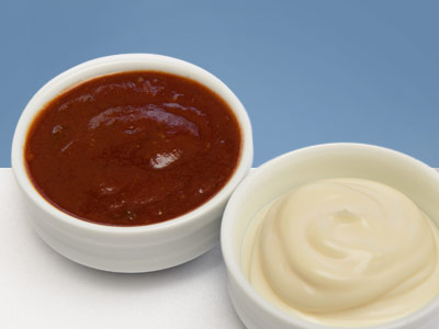 Little dishes of salad dressing and mayonnaise