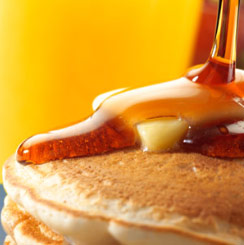 Stack of pancakes with syrup and butter